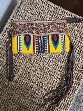 Hand tooled wristlet with fringe
